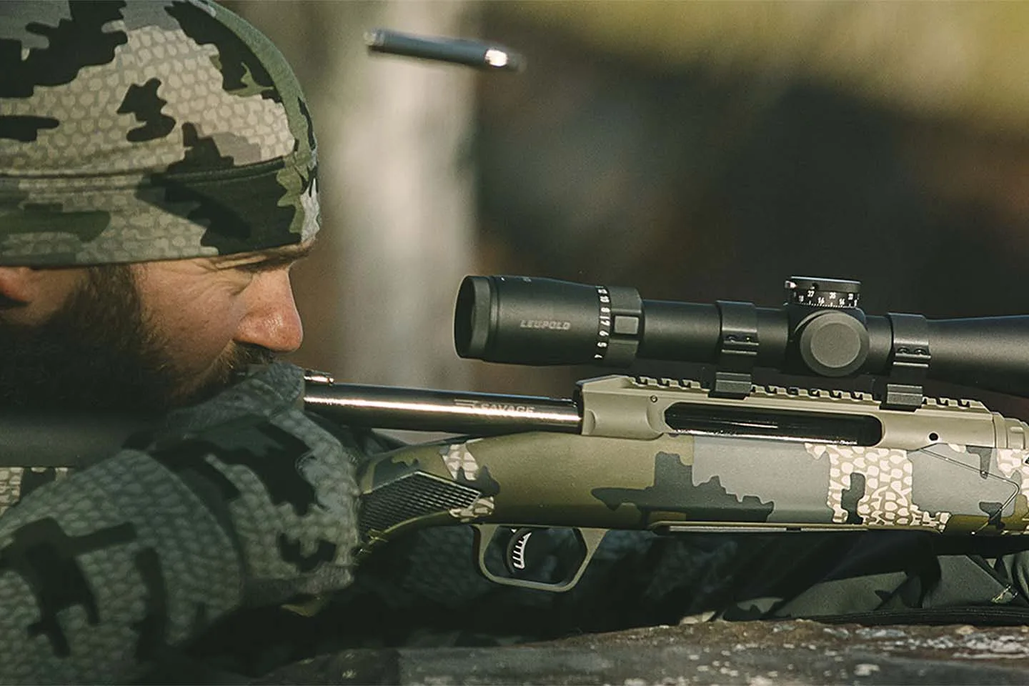 Man in camo shooting Savage Arms rifle